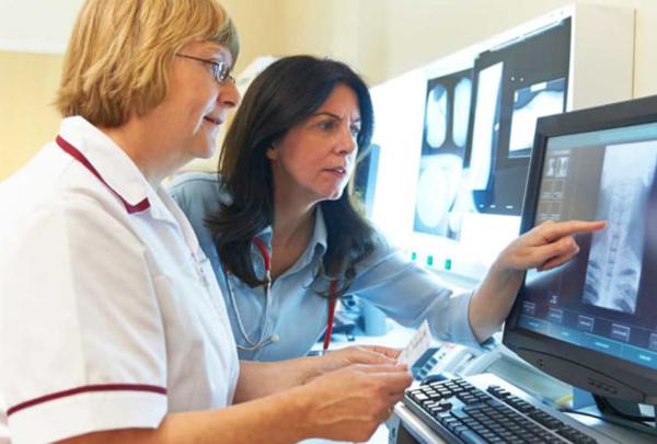 Two women looking at an x-ray.